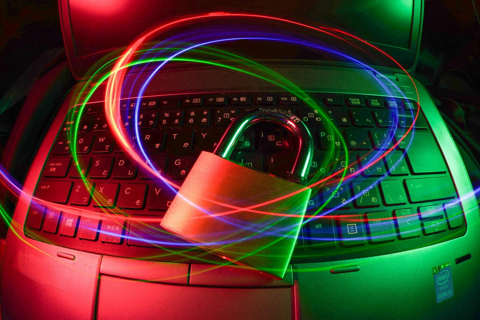 Padlock on a laptop with light trails — Cyber Liability Insurance for California Businesses