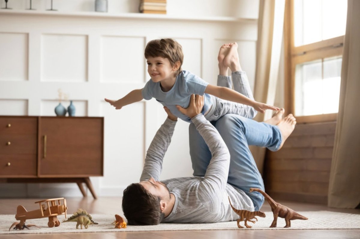 Father and son playing at home — life insurance for Los Angeles families | Blackstone Insurance
